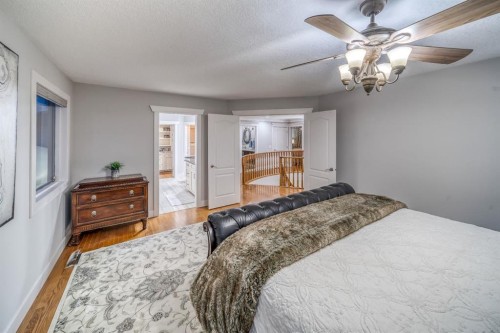158 Gleneagles View, Cochrane, AB - Indoor Photo Showing Bedroom