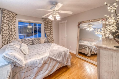 158 Gleneagles View, Cochrane, AB - Indoor Photo Showing Bedroom