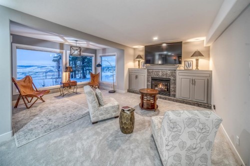 158 Gleneagles View, Cochrane, AB - Indoor Photo Showing Living Room With Fireplace