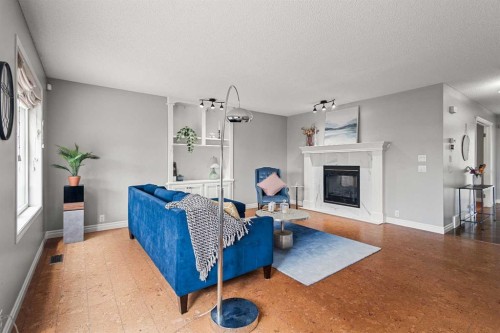 15209 Prestwick Boulevard Se, Calgary, AB - Indoor Photo Showing Living Room With Fireplace