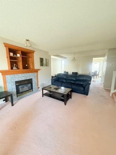 7212 Sierra Morena Boulevard Sw, Calgary, AB - Indoor Photo Showing Living Room With Fireplace
