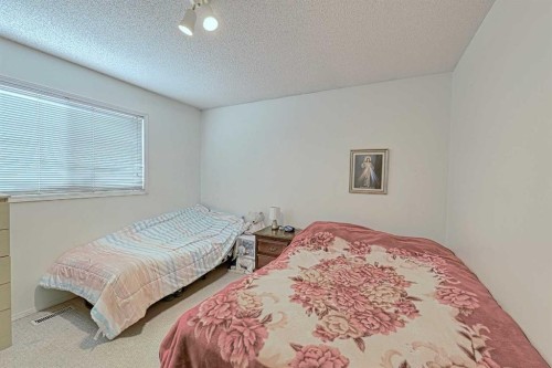 24 Shawmeadows Road Sw, Calgary, AB - Indoor Photo Showing Bedroom