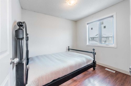 913 Taradale Drive Ne, Calgary, AB - Indoor Photo Showing Bedroom