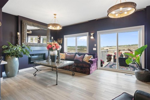 255 Heritage Heights, Cochrane, AB - Indoor Photo Showing Living Room With Fireplace