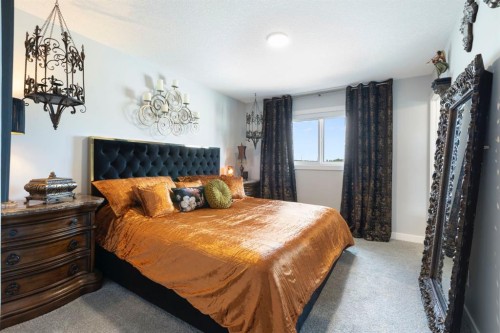 255 Heritage Heights, Cochrane, AB - Indoor Photo Showing Bedroom