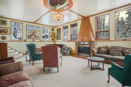 242016 White Post Lane, Rural Foothills County, AB - Indoor Photo Showing Living Room With Fireplace
