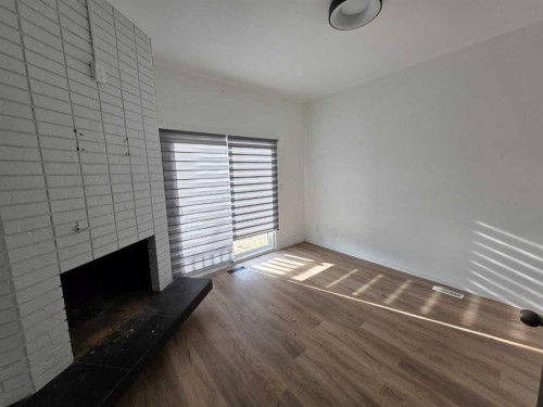 59 Brookpark Crescent Sw, Calgary, AB - Indoor Photo Showing Other Room With Fireplace