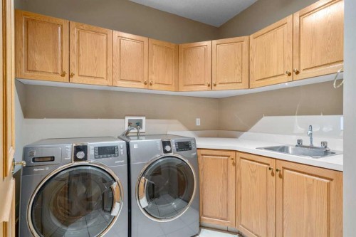12 Prominence Point Sw, Calgary, AB - Indoor Photo Showing Laundry Room