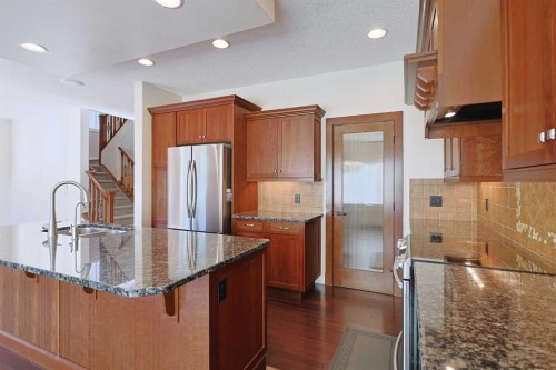 55 Tuscany Estates Drive Nw, Calgary, AB - Indoor Photo Showing Kitchen With Stainless Steel Kitchen With Double Sink With Upgraded Kitchen