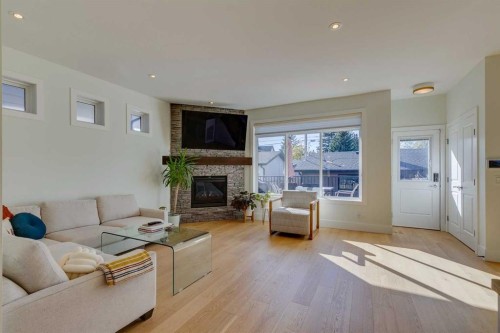 3529 40 Street Sw, Calgary, AB - Indoor Photo Showing Living Room With Fireplace