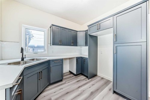 2006 37 Street Se, Calgary, AB - Indoor Photo Showing Kitchen With Double Sink