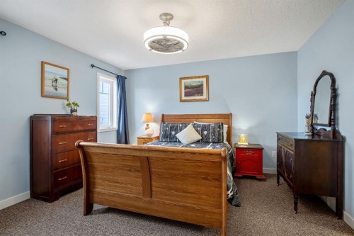 2103 27 Avenue, Nanton, AB - Indoor Photo Showing Bedroom