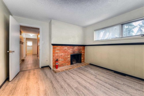 6729 Leeson Court Sw, Calgary, AB - Indoor With Fireplace