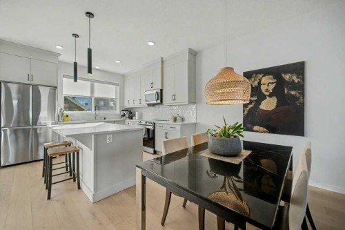 551 Wolf Creek Way Se, Calgary, AB - Indoor Photo Showing Kitchen With Upgraded Kitchen