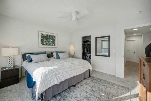 551 Wolf Creek Way Se, Calgary, AB - Indoor Photo Showing Bedroom