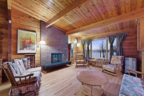 16102 273 Avenue East, Rural Foothills County, AB - Indoor Photo Showing Living Room With Fireplace