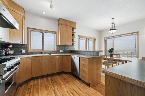 16111 274 Avenue East, Rural Foothills County, AB - Indoor Photo Showing Kitchen With Double Sink