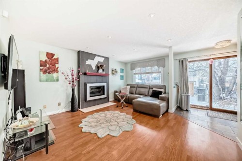 19 Mchugh Place Ne, Calgary, AB - Indoor Photo Showing Living Room With Fireplace