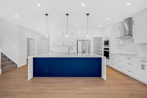 239 Chelsea  Park, Chestermere, AB - Indoor Photo Showing Kitchen With Upgraded Kitchen