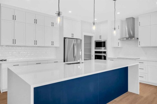 239 Chelsea  Park, Chestermere, AB - Indoor Photo Showing Kitchen With Upgraded Kitchen