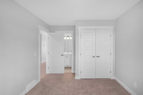 239 Chelsea  Park, Chestermere, AB - Indoor Photo Showing Other Room