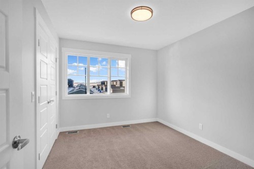 239 Chelsea  Park, Chestermere, AB - Indoor Photo Showing Other Room