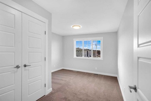 239 Chelsea  Park, Chestermere, AB - Indoor Photo Showing Other Room