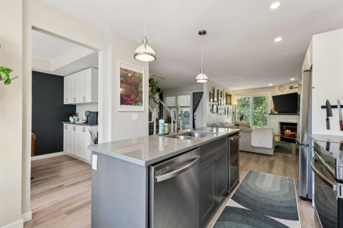 109 Coachway Lane Sw, Calgary, AB - Indoor Photo Showing Kitchen With Double Sink