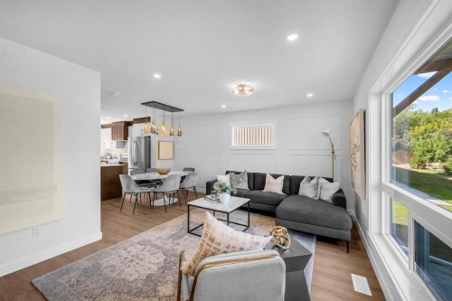 604 Clover Road, Carstairs, AB - Indoor Photo Showing Living Room With Fireplace