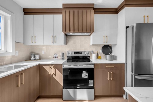 604 Clover Road, Carstairs, AB - Indoor Photo Showing Kitchen With Stainless Steel Kitchen With Double Sink
