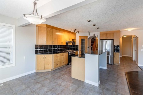 173 Silverado Plains Close Sw, Calgary, AB - Indoor Photo Showing Kitchen With Stainless Steel Kitchen