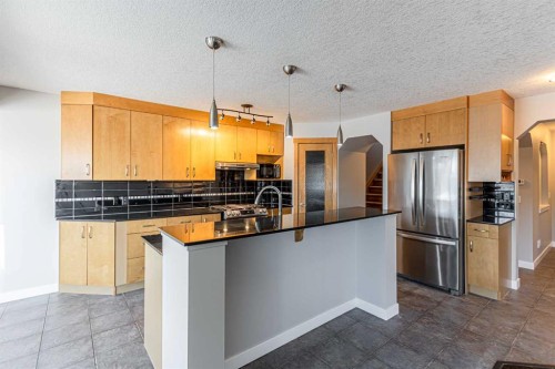 173 Silverado Plains Close Sw, Calgary, AB - Indoor Photo Showing Kitchen With Stainless Steel Kitchen
