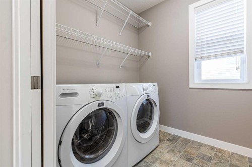 173 Silverado Plains Close Sw, Calgary, AB - Indoor Photo Showing Laundry Room