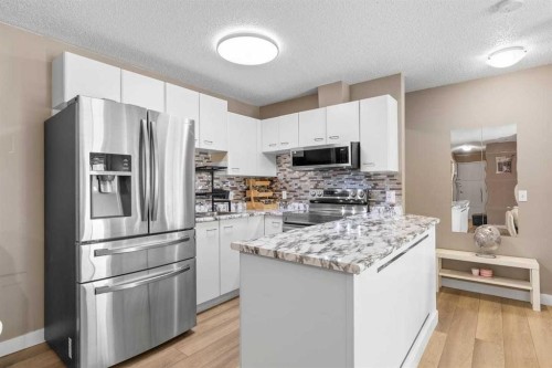 11-2611 Edenwold Heights Nw, Calgary, AB - Indoor Photo Showing Kitchen With Upgraded Kitchen