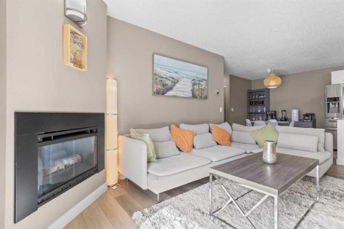 11-2611 Edenwold Heights Nw, Calgary, AB - Indoor Photo Showing Living Room With Fireplace