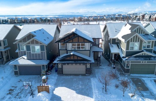 69 Sundown Grove, Cochrane, AB - Outdoor With Deck Patio Veranda With Facade