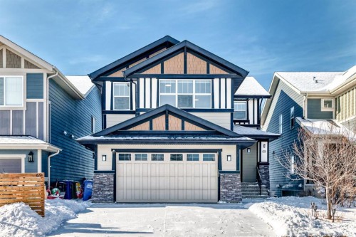 69 Sundown Grove, Cochrane, AB - Outdoor With Facade