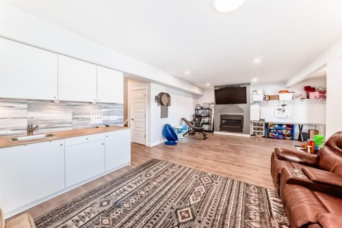 69 Sundown Grove, Cochrane, AB - Indoor With Fireplace