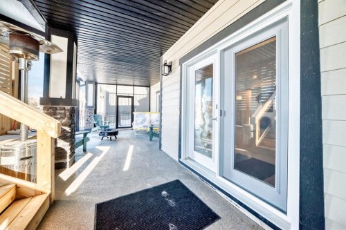 69 Sundown Grove, Cochrane, AB - Outdoor With Deck Patio Veranda With Exterior