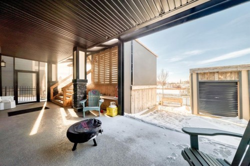 69 Sundown Grove, Cochrane, AB - Outdoor With Deck Patio Veranda With Exterior