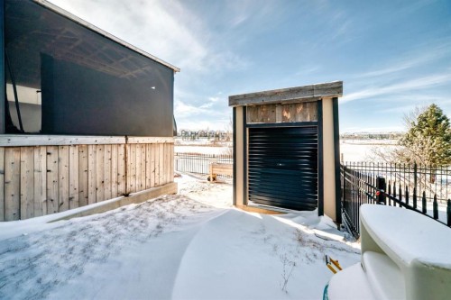 69 Sundown Grove, Cochrane, AB - Outdoor With Exterior