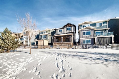 69 Sundown Grove, Cochrane, AB - Outdoor With Facade