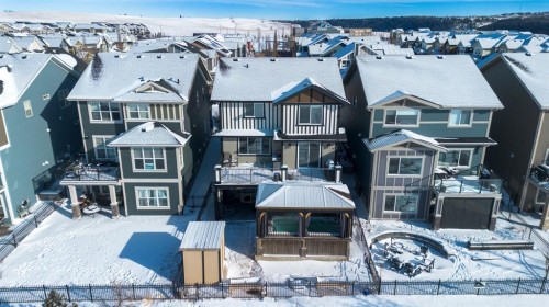 69 Sundown Grove, Cochrane, AB - Outdoor With Facade