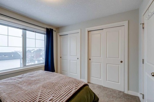 2103 Jumping Pound Common, Cochrane, AB - Indoor Photo Showing Bedroom