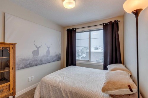 2103 Jumping Pound Common, Cochrane, AB - Indoor Photo Showing Bedroom