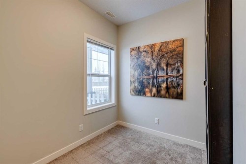 2103 Jumping Pound Common, Cochrane, AB - Indoor Photo Showing Other Room