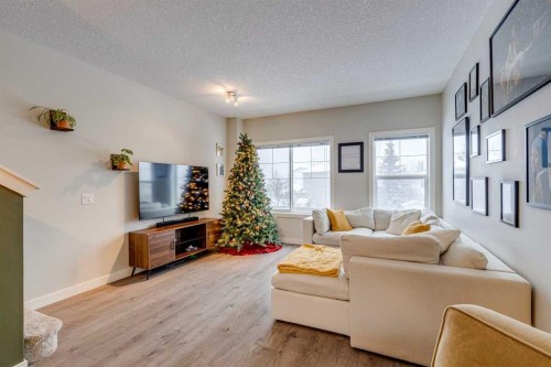 2103 Jumping Pound Common, Cochrane, AB - Indoor Photo Showing Living Room