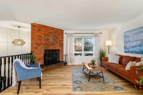 13127 Lake Crimson Drive Se, Calgary, AB - Indoor Photo Showing Living Room With Fireplace