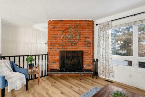 13127 Lake Crimson Drive Se, Calgary, AB - Indoor Photo Showing Living Room With Fireplace