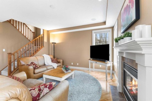 131 Discovery Ridge Way Sw, Calgary, AB - Indoor Photo Showing Living Room With Fireplace